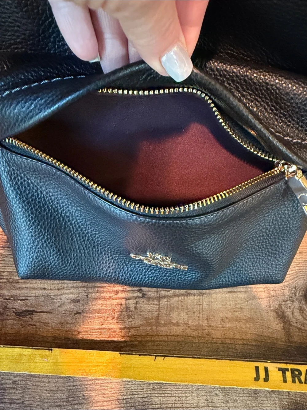 Coach Black Pebbled Leather Backpack with Gold-Tone Accents